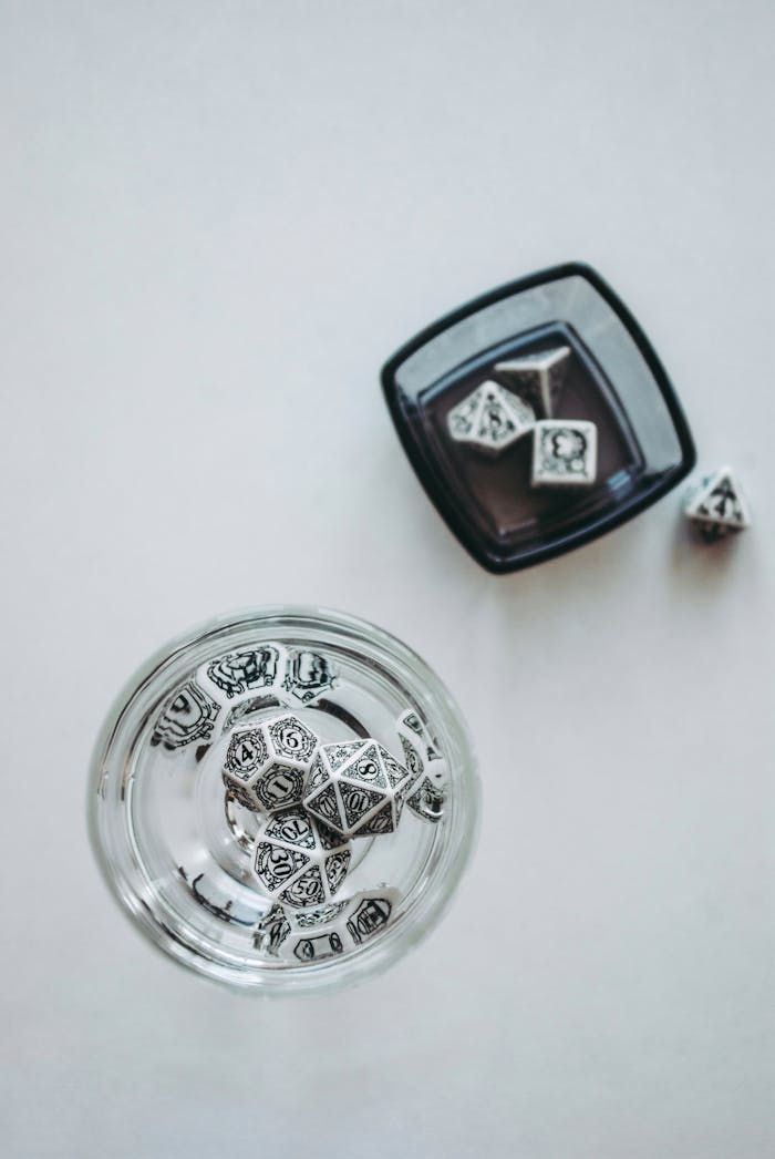 why-choose-us Ornate dice in clear bowls on a white background, showcasing elegant design.
